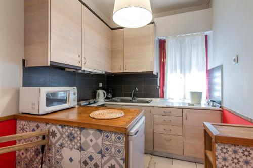 Kjøkken eller kjøkkenkrok på Blue & Red Apartment