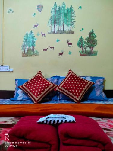 a bedroom with a bed with blue sheets and pillows at Hotel The Village Heart in Sawāi Mādhopur