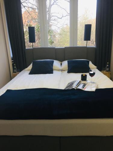 a bedroom with a large bed with a window at Apartament Bora Stronie Śląskie in Stronie Śląskie