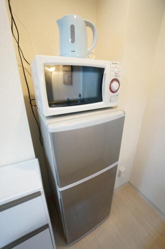 Η κουζίνα ή μικρή κουζίνα στο Downtown area Spacious cozy room Susukino IK901