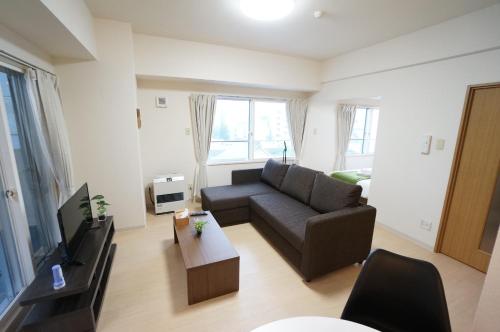 Μια τηλεόραση ή/και κέντρο ψυχαγωγίας στο Downtown area Spacious cozy room Susukino IK901
