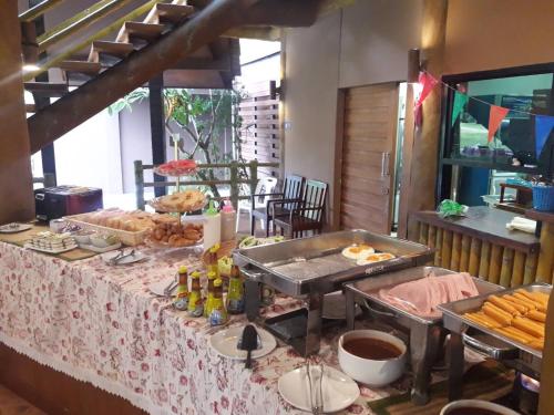 a table with a buffet of food on it at Blues River Resort in Chao Lao Beach