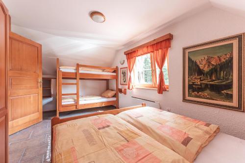 Postel nebo postele na pokoji v ubytování POHORJE HOUSE 2 FOUR APPARTMETNS