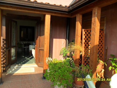 an open door of a house with a porch at B&B Home Holiday Villa delle Acacie agriturismo in Sala Consilina