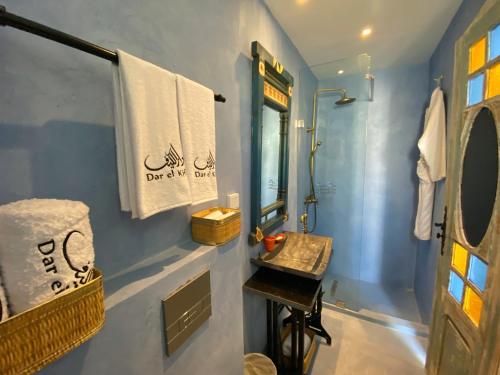 a bathroom with a sink and a mirror at Dar El Kif - La Marsa in La Marsa