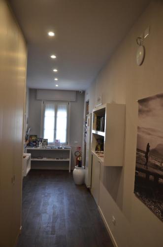 a room with a bathroom with a sink and a window at H2o in Sirmione
