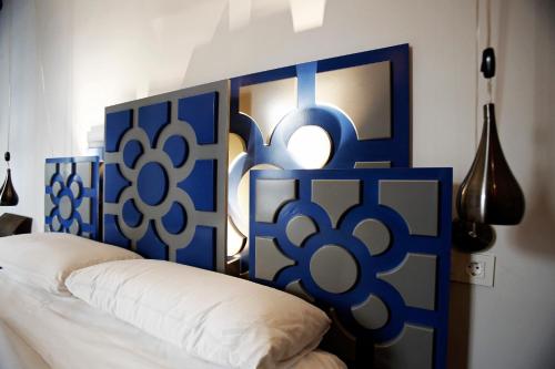 a blue and white headboard of a bed in a room at Pensión Basque Boutique in Bilbao