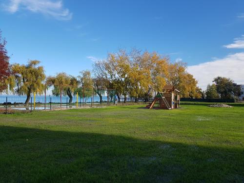 a park with a playground and a play structure at Silver Apartman in Siófok