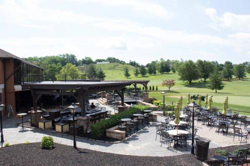 a patio with tables and chairs in a park at Heritage Hills Golf Resort & Conference Center in York