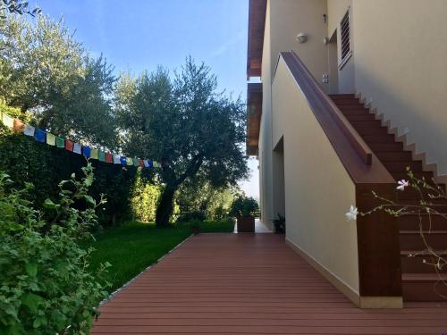 a walkway leading to a house with prayer flags at Barcuzzi in Barcuzzi