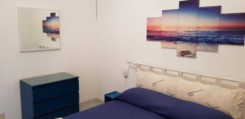 Postel nebo postele na pokoji v ubytování L'Incanto di Cala Feola