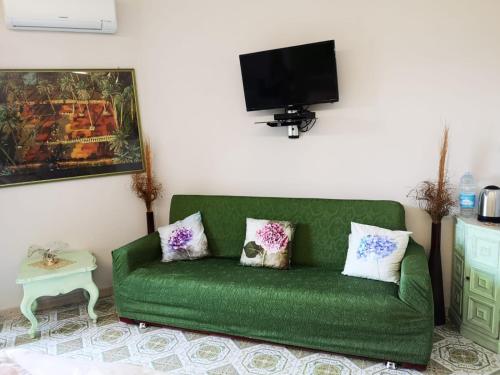 Televízia a/alebo spoločenská miestnosť v ubytovaní B&B L ORTENSIA