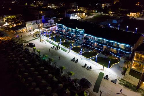 an aerial view of a city at night at Barocco Wave Hotel in Skala Potamias