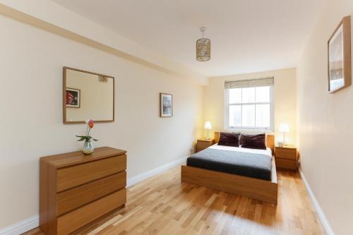 Ένα ή περισσότερα κρεβάτια σε δωμάτιο στο Regents Canal Apartments
