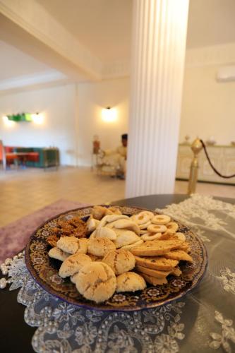 a plate of cookies sitting on a table at Tiguemine Sarah in Marrakech