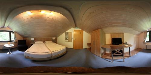 Postel nebo postele na pokoji v ubytování Hotel Auf dem Kamp
