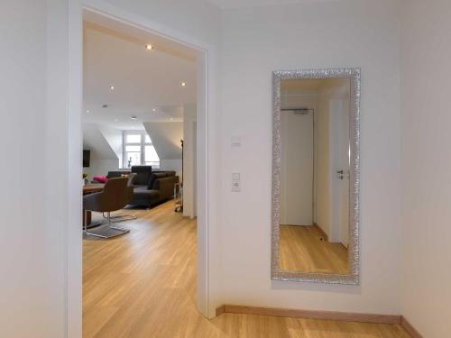 a mirror on a wall in a living room at Sielhof Ditzum, 45222 in Ditzum