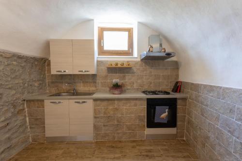 A kitchen or kitchenette at Lancillotto