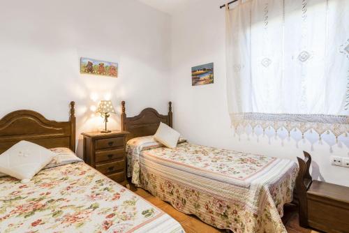 Giường trong phòng chung tại La casa del estanque