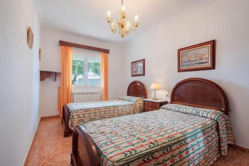 Postel nebo postele na pokoji v ubytování Villa en Son Gall Ciutadella