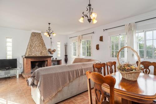 a living room with a couch and a table at Casa de Piedra in El Cañal