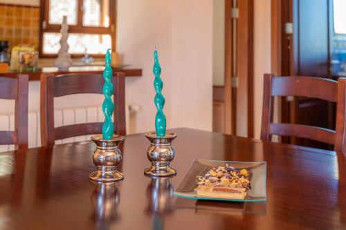 two candles on top of a table with a cake at Cas Pobler in Manacor