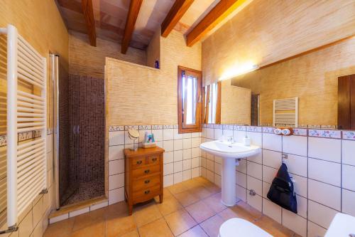 a bathroom with a sink and a mirror at Finca Mirador Capdepera in Capdepera