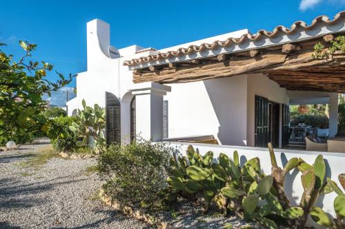 a villa with a view of the ocean at Casa Mamita Ibiza in Sant Jordi
