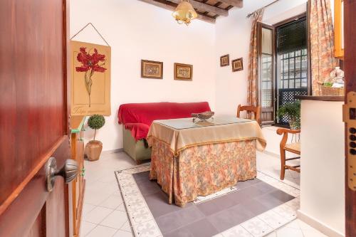 a living room with a table and a couch at Casa Pepa in Conil de la Frontera