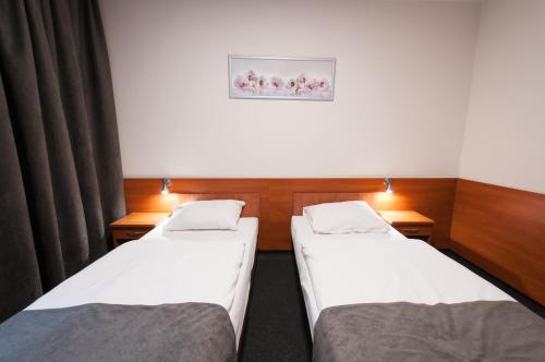 Ένα ή περισσότερα κρεβάτια σε δωμάτιο στο Hotel Biały