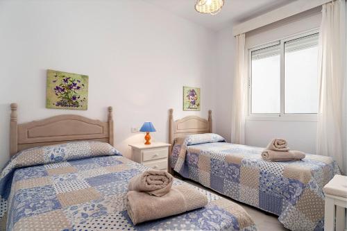 Postel nebo postele na pokoji v ubytování Apartamento Antonia