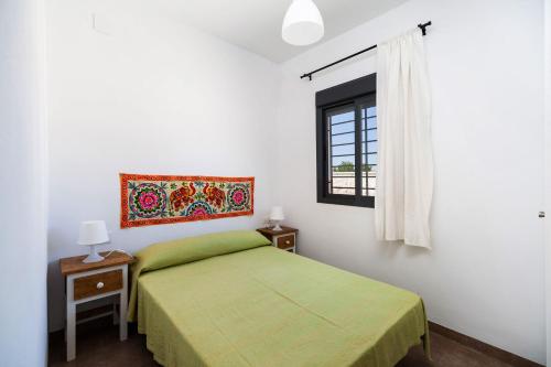 Posteľ alebo postele v izbe v ubytovaní Villa Los Olivares