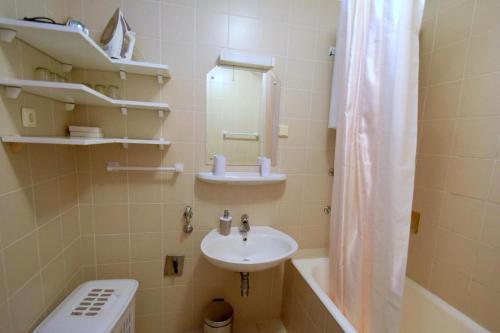 a bathroom with a sink and a toilet and a shower at Apartment Zdenka in Njivice