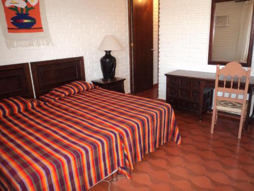 Ένα ή περισσότερα κρεβάτια σε δωμάτιο στο La Casa Contenta