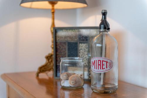 a bottle of wine sitting on a table with a glass at Bennassar 2 in Felanitx