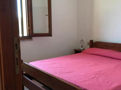 Voodi või voodid majutusasutuse Il Boschetto dei Corbezzoli Villetta 1h toas