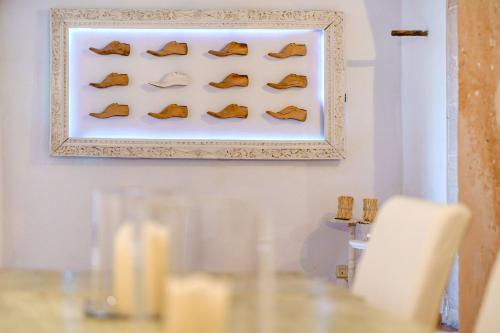 a display of shoes on a wall in a room at Finca Buniferri in Llucmajor