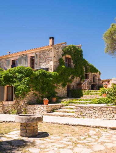 a stone building with stairs in front of it at Son Reus in Felanitx