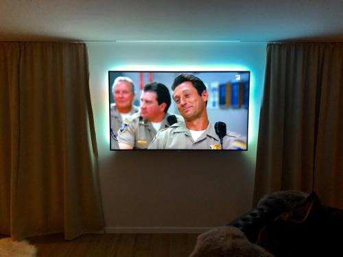 a tv screen with three military men on a wall at Luxus Spa auf tollem Anwesen in Neubulach
