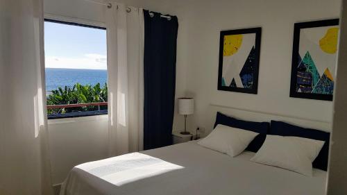 En eller flere senge i et værelse på Casita Elmar