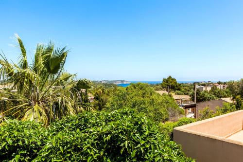 a view of the ocean from the balcony of a house at Casa Mediterranea Invierno in Cala Llombards
