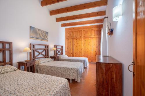 Postel nebo postele na pokoji v ubytování Los Arcos