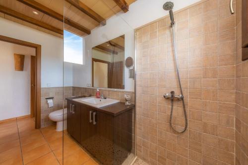 a bathroom with a sink and a shower at Es clonanell in Capdepera