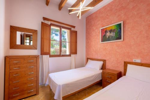 Giường trong phòng chung tại Villa Rosa