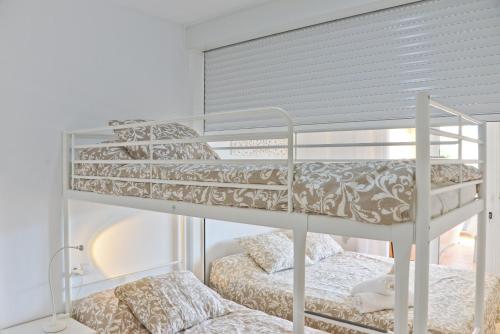 Двухъярусная кровать или двухъярусные кровати в номере Casa el Copo