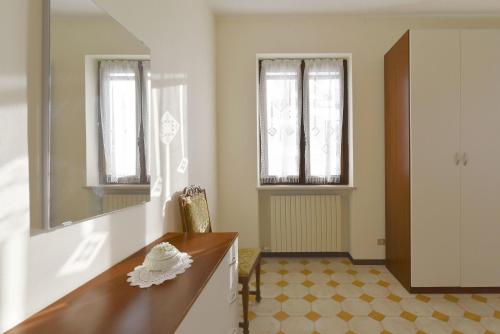 a bathroom with a counter and a mirror at Casa Nonna Rina in Monzambano