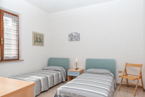 Postel nebo postele na pokoji v ubytování Villetta Corbezzolo