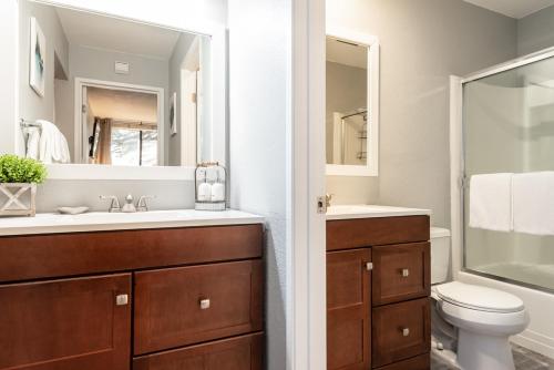 a bathroom with a sink and a toilet and a mirror at San Sierra 2 in Mammoth Lakes