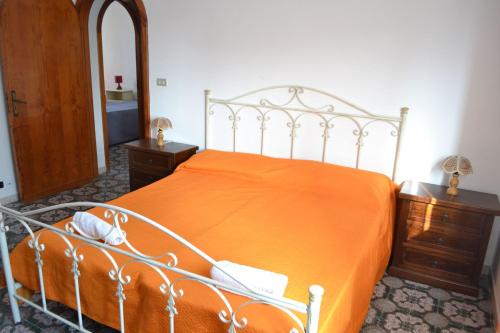 Ένα ή περισσότερα κρεβάτια σε δωμάτιο στο Appartamento 8 pax vicino spiaggia