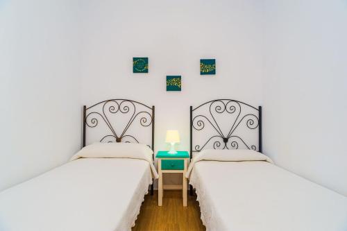 Postel nebo postele na pokoji v ubytování Villa Charco del Sultán